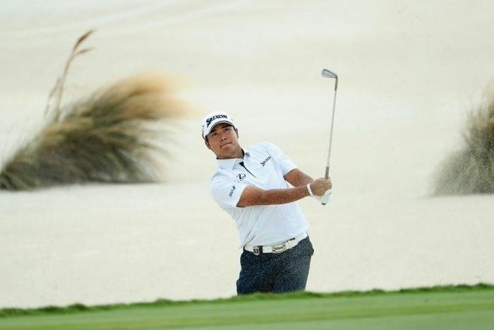 Hideki Matsuyama of Japan hits a shot from a greenside bunker on the third hole during the final round of the Hero World Challenge at Albany, The Bahamas on December 4, 2016