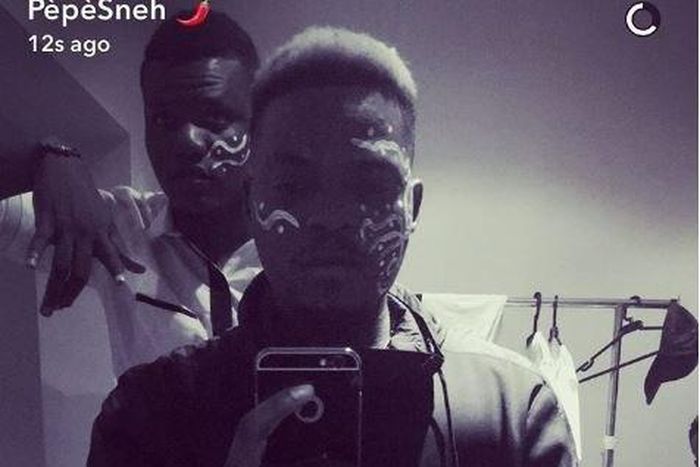 Olamide reconnects with Fela with his white paint on his face