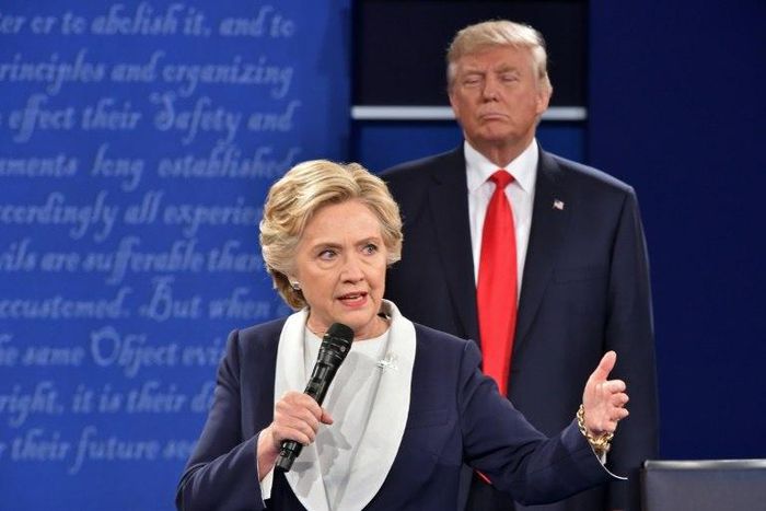 Republican presidential candidate Donald Trump listens to Democratic candidate Hillary Clinton during the second presidential debate in St. Louis, Missouri on October 9, 2016