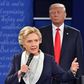 Republican presidential candidate Donald Trump listens to Democratic candidate Hillary Clinton during the second presidential debate in St. Louis, Missouri on October 9, 2016