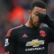 Memphis Depay walks away dejected after his error at the back led to Stoke's opener