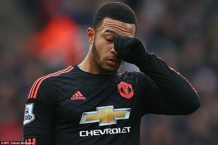Memphis Depay walks away dejected after his error at the back led to Stoke's opener