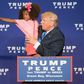 Republican presidential nominee Donald Trump holds a child as he speaks during a rally at the KI Convention Center on October 17, 2016 in Green Bay, Wisconsin