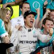 Mercedes' Formula One driver Nico Rosberg of Germany celebrates with his team after winning the Formula One world championship. REUTERS/Ahmed Jadallah