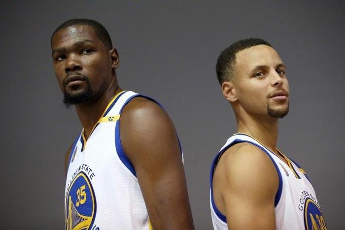 Kevin Durant #35 and Stephen Curry #30 of the Golden State Warriors pose during a media shoot at the Warriors Practice Facility on September 26, 2016 in Oakland, California
