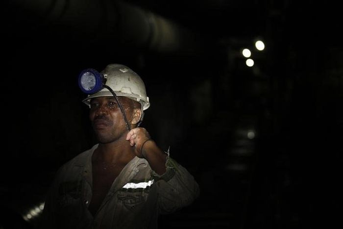 A mine worker is seen underground  at Lonmin's Karee mine in Rustenburg, 100 km (62 miles) northwest of Johannesburg, March 5, 2013.   REUTERS/Siphiwe Sibeko
