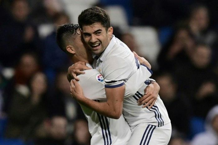 Real Madrid's French midfielder Enzo Zidane Fernandez (R) and Real Madrid's forward Mariano celebrate after scoring a goal against Cultural y Deportiva Leonesa at Santiago Bernabeu stadium in Madrid on November 30, 2016