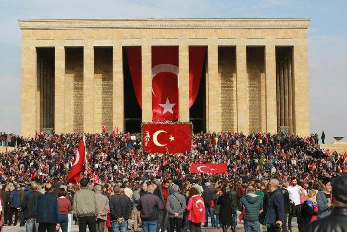 People wave Turkish flags at the Anitkabir, the mausoleum of the founder of Turkish Republic Mustafa Kemal Ataturk, during celebrations marking the 93rd Anniversary of Republic Day in Ankara on October 29, 2016
