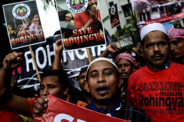 Rohingya Muslim refugees protest against the persecution of Rohingya Muslims in Myanmar, outside the Myanmar Embassy in Kuala Lumpur on November 25, 2016