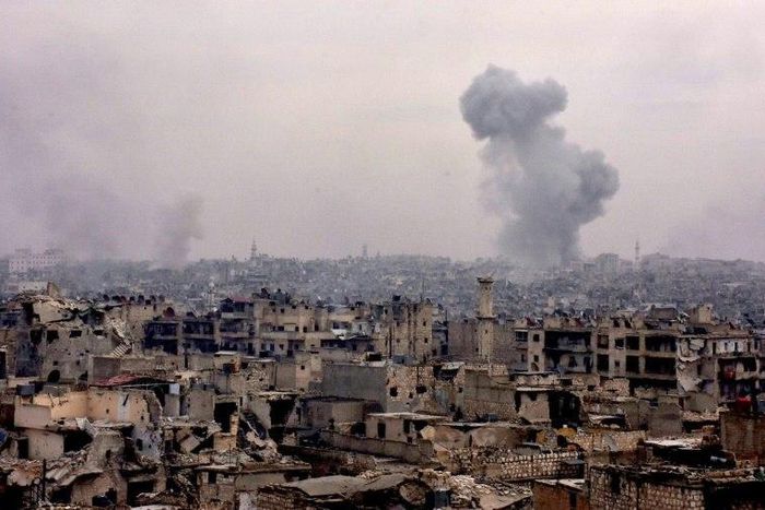 Smoke rises from buildings in Aleppo's eastern Karm al-Jabal neighbourhood on December 5, 2016