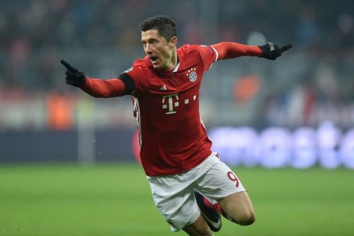 Bayern Munich's striker Robert Lewandowski celebrates scoring the opening goal during the UEFA Champions League group D football match between FC Bayern Munich and Atletico Madrid in Munich, southern Germany, on December 6, 2016