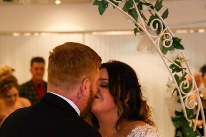 This couple strike blow-job postures for some of their wedding pictures