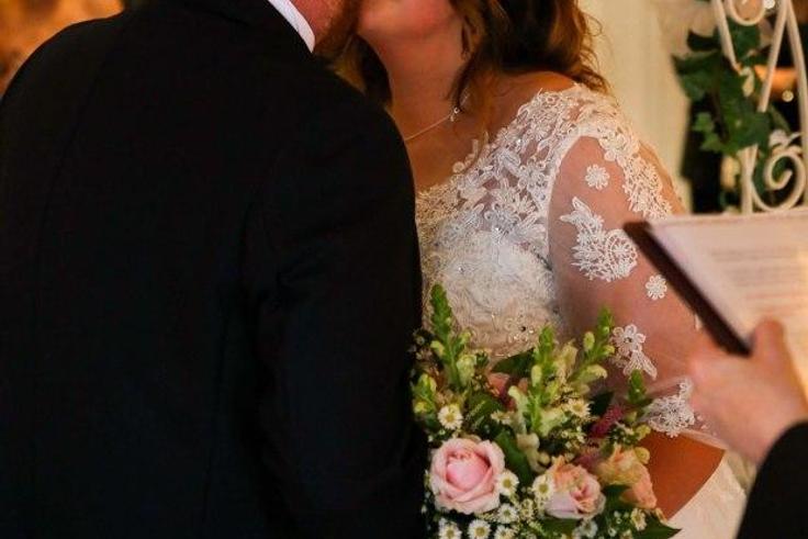 This couple strike blow-job postures for some of their wedding pictures