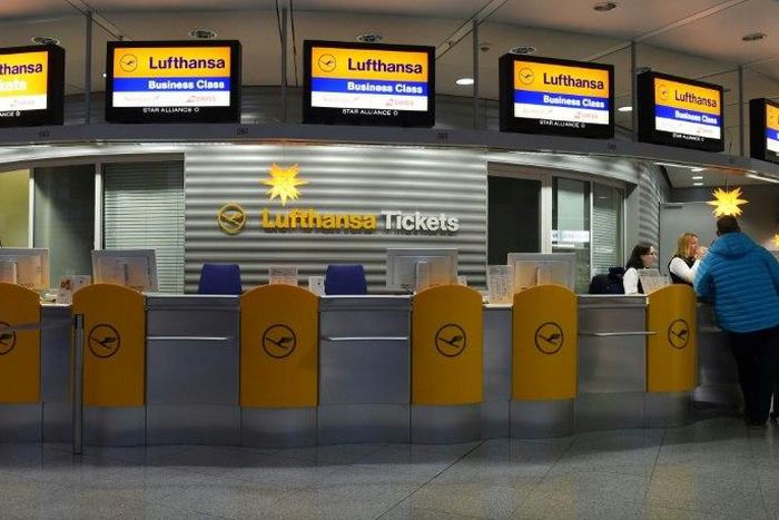 A flight passenger stands at a counter of German airline Lufthansa, as the pilots plan to continue their strike, following a dispute concerning wages that ended without a resolution