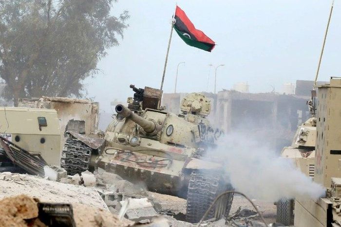 Pro-government forces take position in the Libyan city of Sirte during clashes with Islamic State jihadists