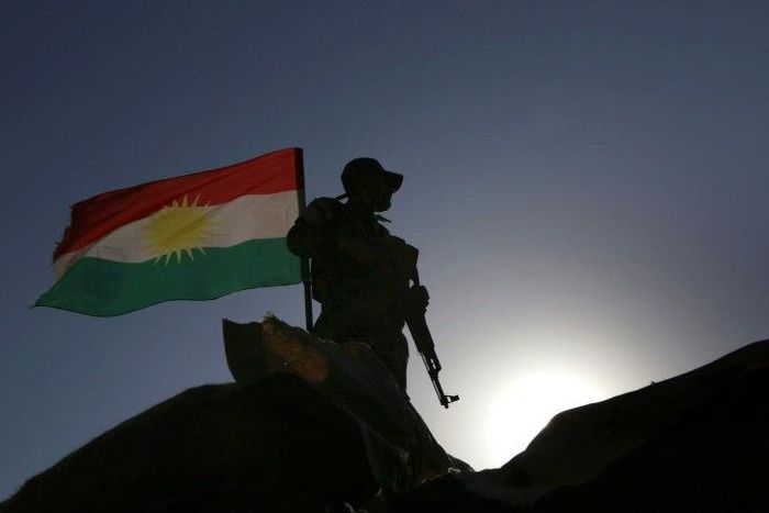 An Iraqi Kurdish Peshmerga fighter holds a position in Sheikh Ali village near the town of Bashiqa, on November 6, 2016