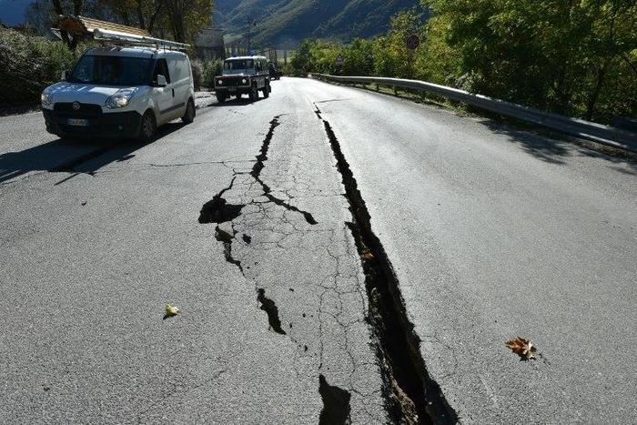Cracks on the road outside the centre of Norcia, central Italy pictured a day after a 6.5-magnitude earthquake struck on October 30, 2016