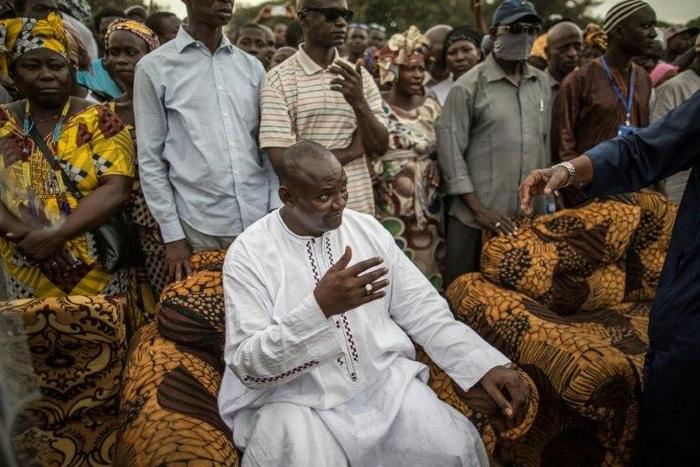 Adama Barrow, the flag-bearer of the coalition of the seven opposition political parties in Gambia, gestures while greeting supporters during a gathering on November 29, 2016