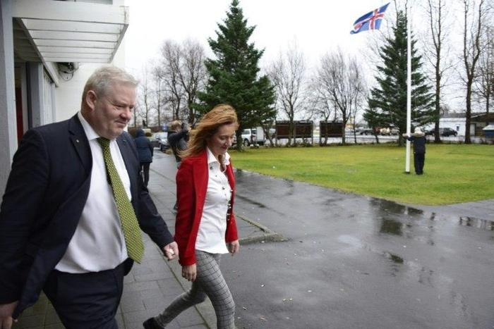 Iceland's Prime Minister Sigurdur Ingi Johannsson (L) leaves a polling station with his wife Ingibjoerg Elsa Ingjaldsdottir after voting in Fludir, Iceland, during the snap general election, on October 29, 2016