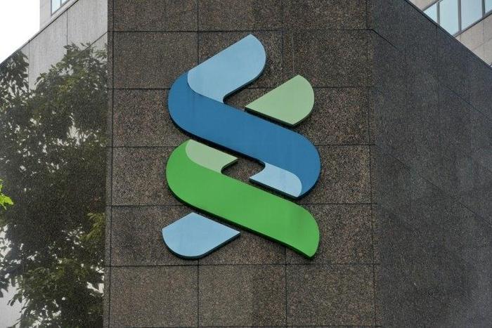 Singapore's financial regulator has fined two British banks, including Standard Chartered Bank, in a widening crackdown on money laundering linked to Malaysian state fund 1MDB