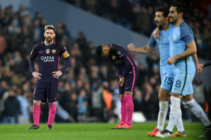 Barcelona's Lionel Messi (L) and Neymar (2L) react as Manchester City's Jesus Navas (2R) and Ilkay Gundogan leave the pitch in Manchester, north west England on November 1, 2016