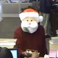 Santa Claus gives out candy before robbing a bank in America.