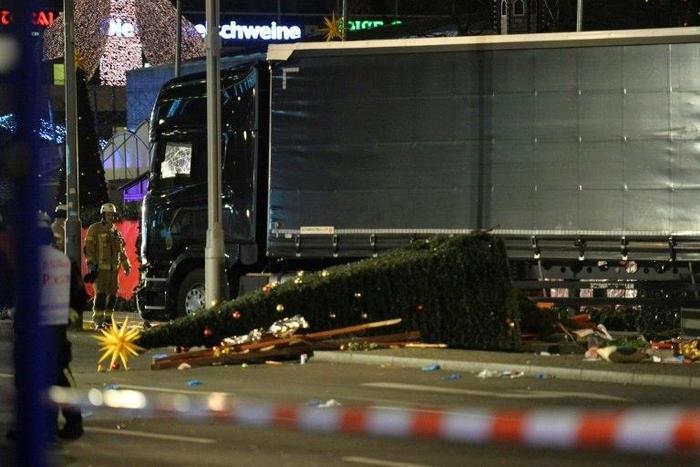 A Christmas tree lies next to a truck that crashed into a market in Berlin, on December 19, 2016
