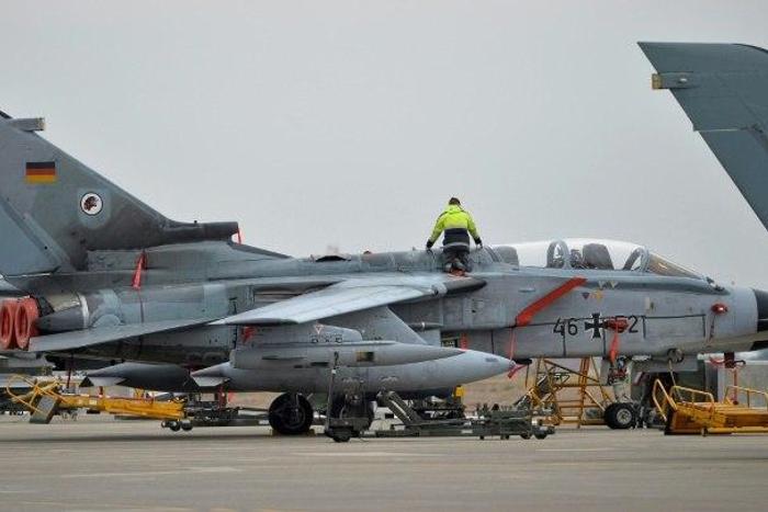 A technician works on a German Tornado jet at the air base in Incirlik, Turkey, on January 21, 2016