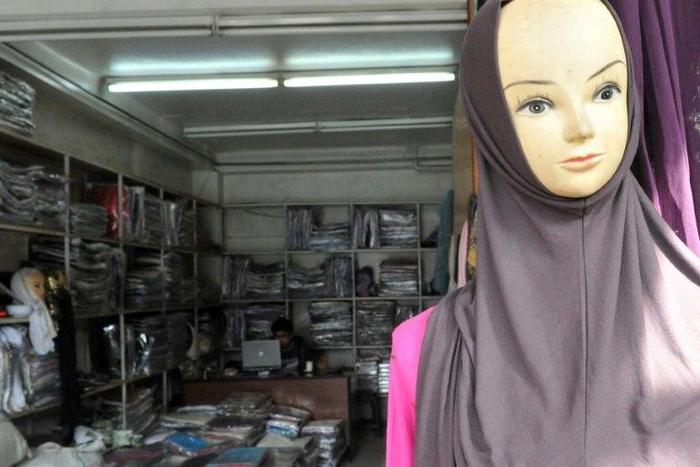 Islamic headware is sold in a Chinese owned store in the quarter of Derb Omar in Casablanca on March 10, 2011