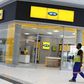 A worker walks past an outlet of South Africa's MTN Group in Johannesburg, South Africa, February 23, 2016. REUTERS/Siphiwe Sibeko