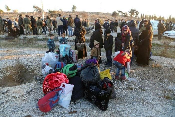 Syrians evacuated from rebel-held neighbourhoods in the embattled city of Aleppo, arrive in opposition-controlled Khan al-Aassal region, west of the city