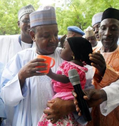 Governor Atiku Bagudu Of Kebbi State, Deworming A Child During Maternal Newborn And Child Health Week In Birnin Kebbi on August 10, 2015.