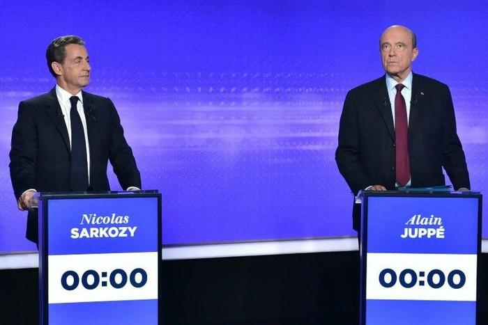 Former French president Nicolas Sarkozy (left) and ex-premier Alain Juppe prepare to take part in a televised debate in Paris, on November 17, 2016