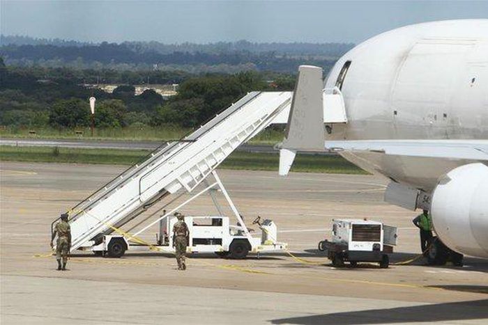 Stowaway migrants found crushed under trucks