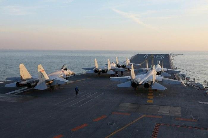 China's Liaoning aircraft carrier on exercise early in December -- the vessel and escorts has sailed south of Taiwan and into the South China Sea