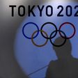 A shadow of of Tokyo governor Yuriko Koike is seen on the logo of Tokyo 2020 Olympic games during the Olympic and Paralympic flag-raising ceremony at Tokyo Metropolitan Government Building in Tokyo, Japan, September 21, 2016.