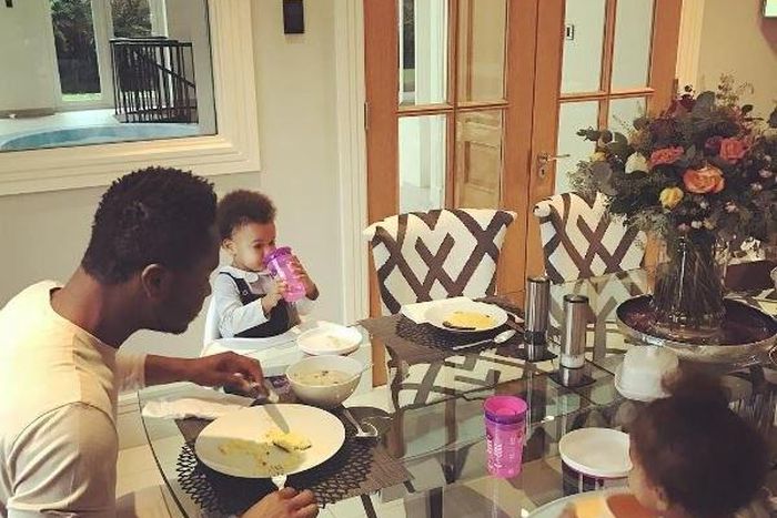 Mikel Obi having breakfast with his daughters