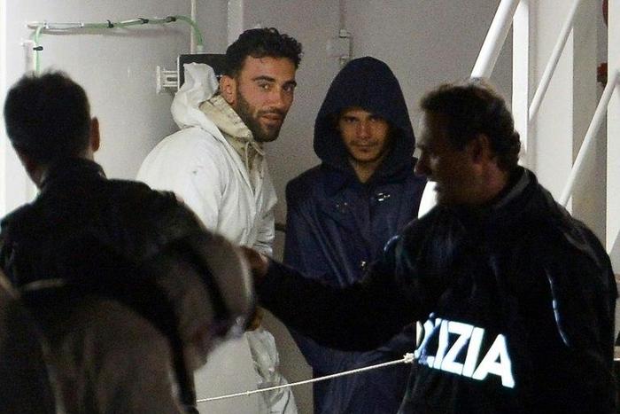 Mohammed Ali Malek (2nd L), one of the survivors and understood to be the captain of the boat that overturned off the coasts of Libya, seen onboard the Italian Coast Guard vessel Bruno Gregoretti, in April 2015