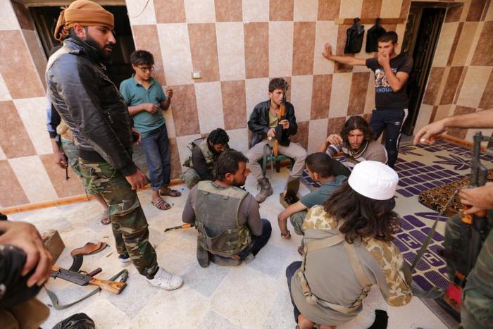 Rebel fighters of 'Al-Sultan Murad' brigade gather on the outskirts of the northern Syrian town of Shawa, which is controlled by Islamic State militants, in Aleppo Governorate, Syria, September 28, 2016