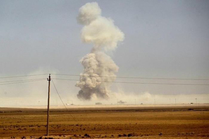 Smoke billows as Iraqi forces deploy in the area of al-Shurah, south of Mosul on October 17, 2016