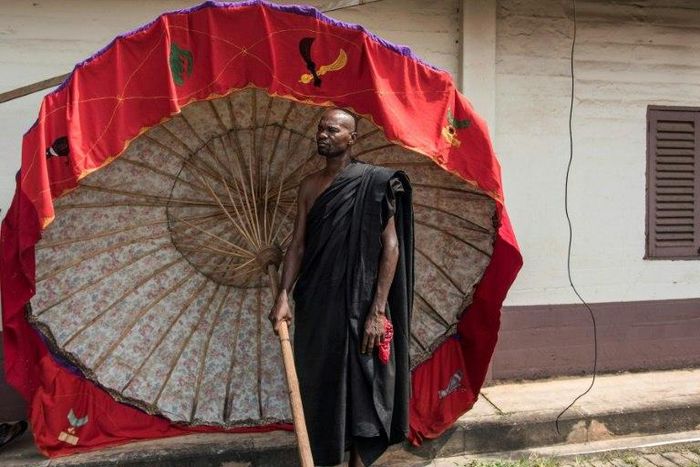 A man carrying a tradionnal umbrella in Kumasi on November 24 at a ceremony following the death of Nana Afia Kobi Serwaa Ampem II