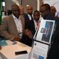 MD/CEO, Precise Financial Systems [PFS], [middle] demonstrates how the iTeller Mobile Cheque Truncations works while Deputy MD, PFS, Philips Ayeni (left), President, Nigeria Computer Society [NCS] Prof. Sola Aderonmu, [second left) and Director General...