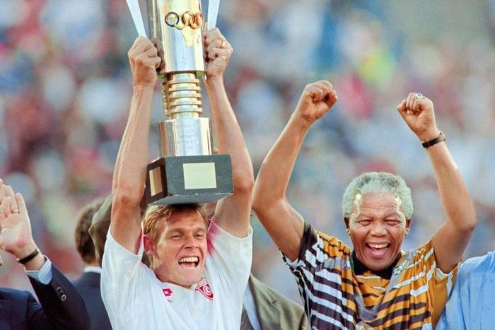South African football legend and current national technical director of football, Neil Tovey, pictured after 1996 Africa Cup of Nations win with then-President Nelson Mandela, had a previous heart health scare while playing squash in 2015