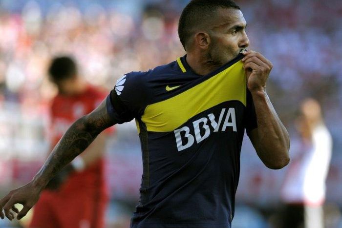 Boca Juniors' forward Carlos Tevez celebrating after scoring against River Plate on December 11, 2016, will make around 38 million euros a season, for Shanghai Shenhua