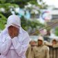 A Muslim woman is caned in Banda Aceh, Indonesia, on October 17, 2016