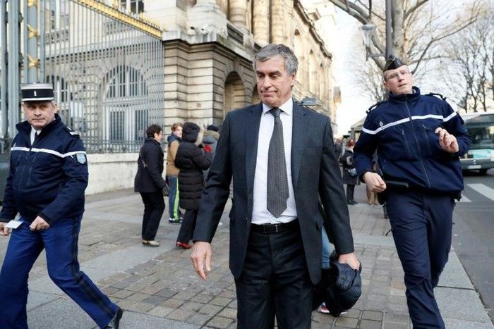 Former French budget minister Jerome Cahuzac (centre) leaves the Paris courthouse following his tax fraud trial on December 8, 2016