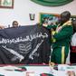 Army presents captured Boko Haram flag to President Muhammadu Buhari