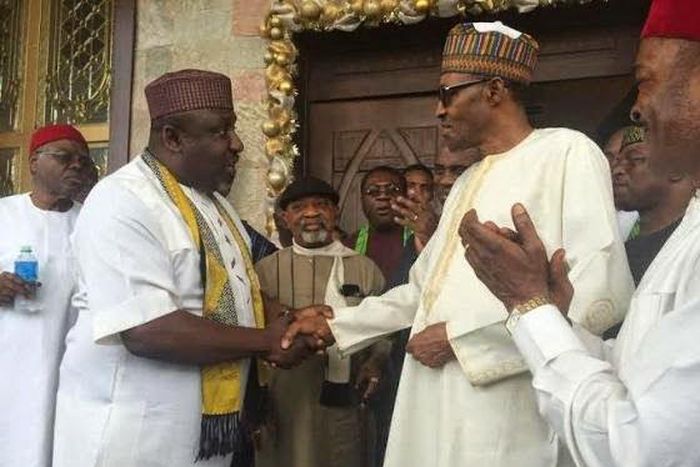 Imo State Governor, Rochas Okorocha shakes President Muhammadu Buhari