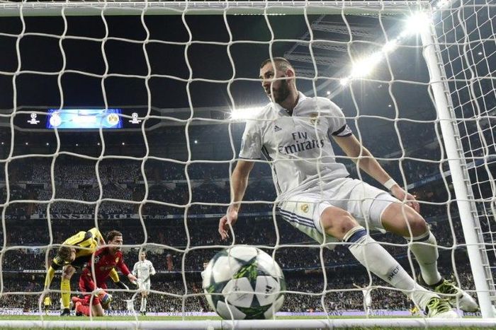 Real Madrid's Karim Benzema celebrates after scoring a goal during their UEFA Champions League Group F match against Borussia Dortmund, at the Santiago Bernabeu stadium in Madrid, on December 7, 2016