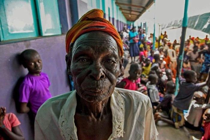 A woman arrives to watch the screening of the start of the International Criminal Court trial of former child soldier-turned-warlord Dominic Ongwen in Lukodi, Uganda on December 6, 2016